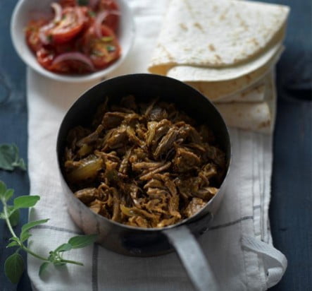 Beef barbacoa served with tortillas
