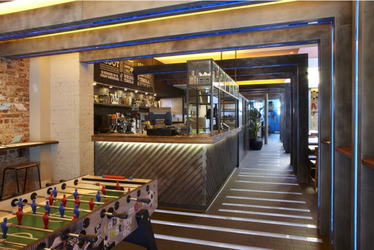 Bar area in Wahaca Islington with table football game