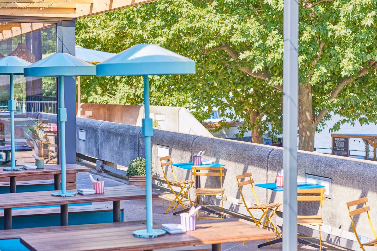 Outdoor seating for bigger and smaller groups in the sunshine at Wahaca Southbank