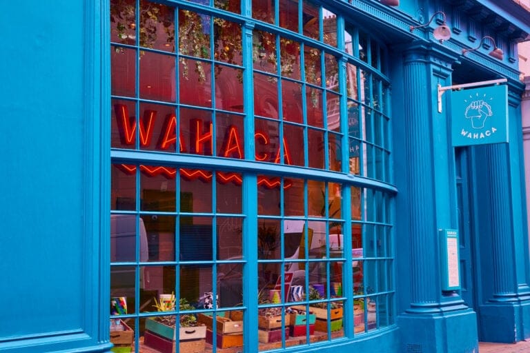 Vibrant exterior of Wahaca Covent Garden with large window