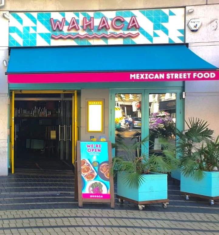 Outside of Wimbledon Wahaca with warm welcoming colours