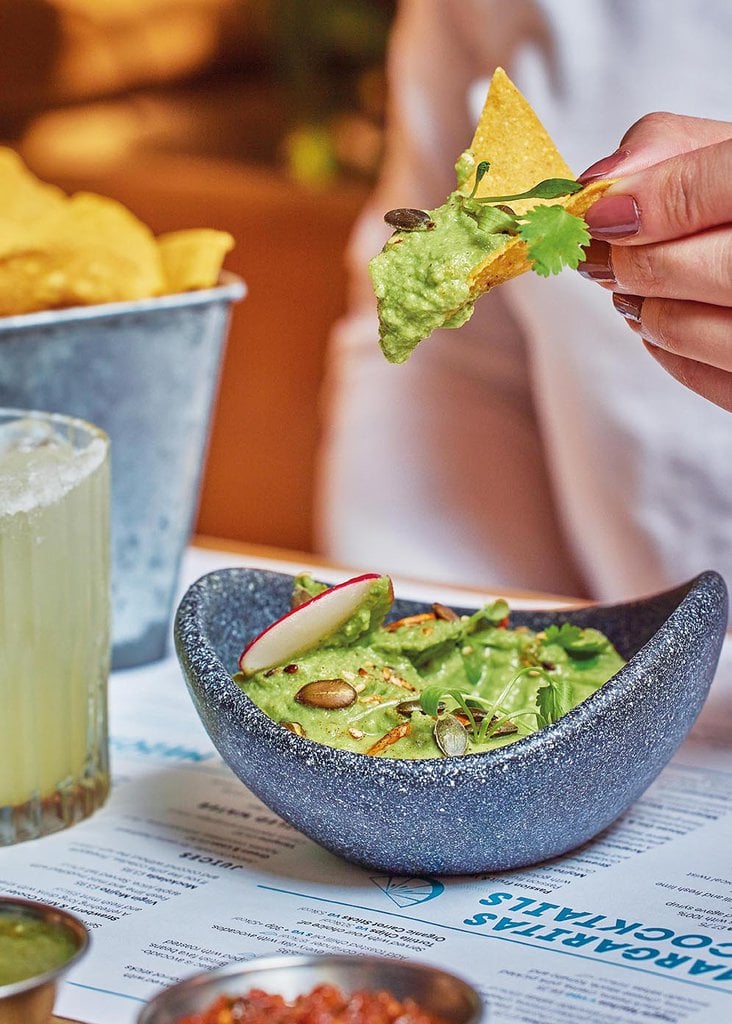 Wahacamole our sustainable take on a dip, with a tortilla chip loaded with a scoop