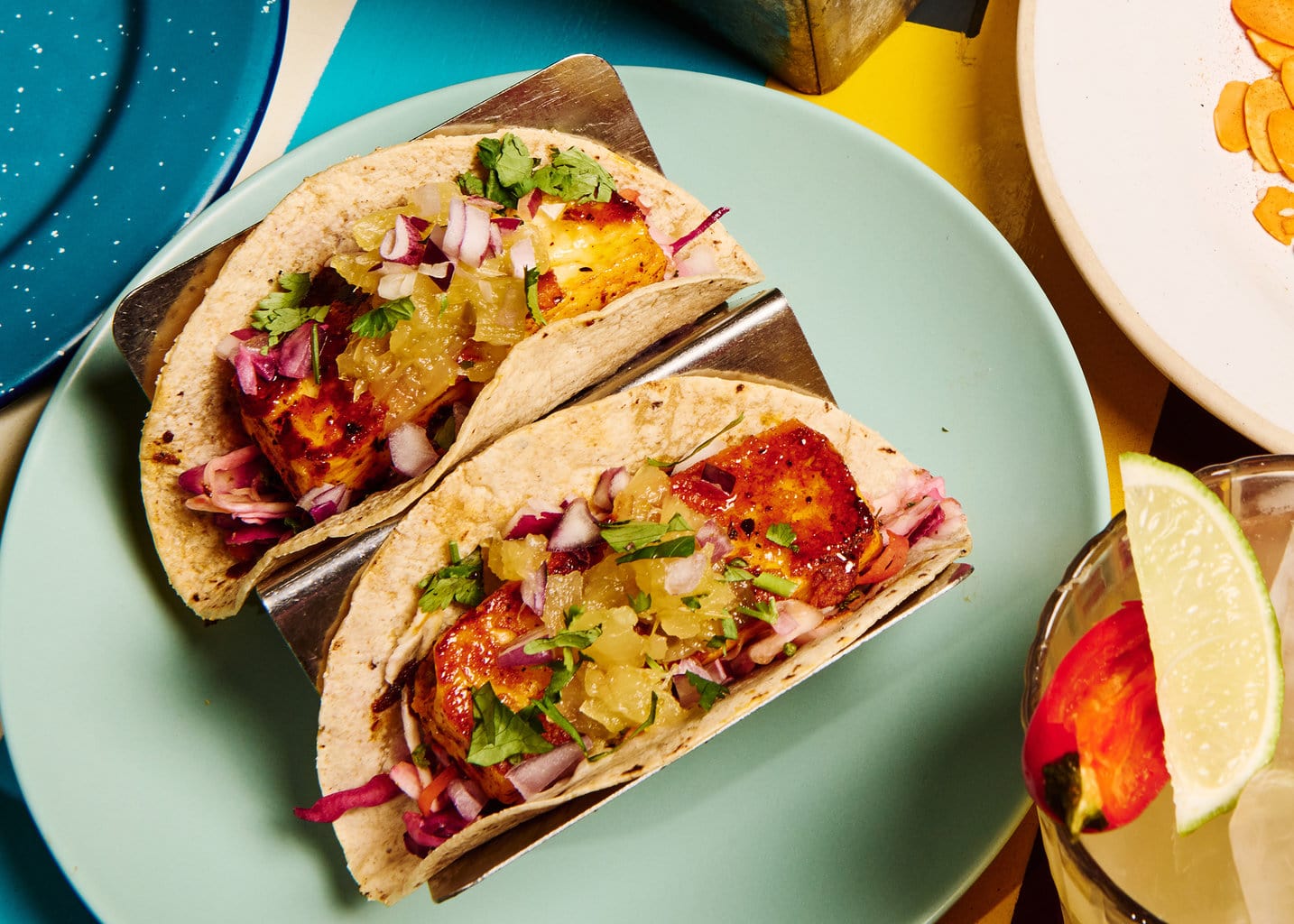 Halloumi tacos topped with pineapple salsa