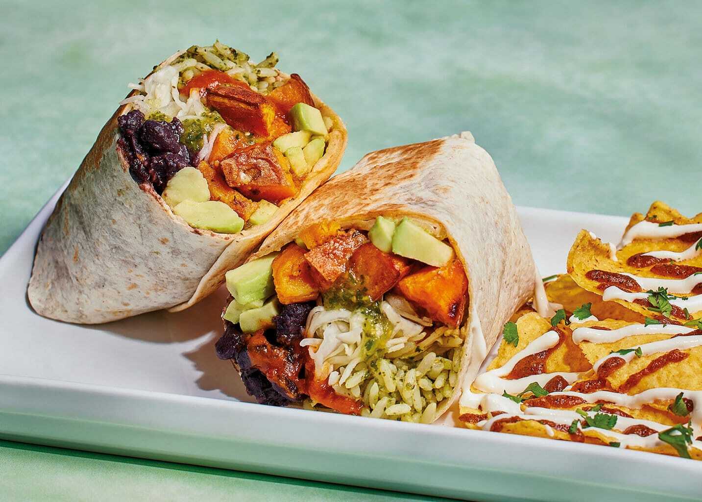 Sweet potato burrito cut in half to reveal fresh ingredients