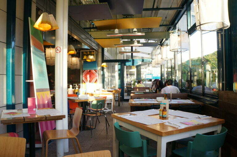 Bright tables by the windows in Wahaca White City