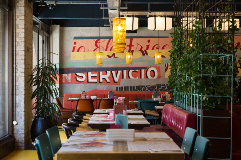 Interior of Wahaca Edinburgh with colourful wall art