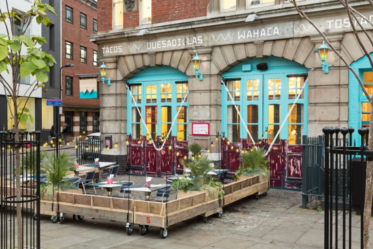 Exterior of Wahaca Shoreditch with terrace tables