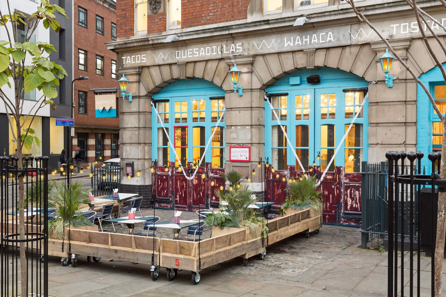 Exterior of Wahaca Shoreditch with terrace tables