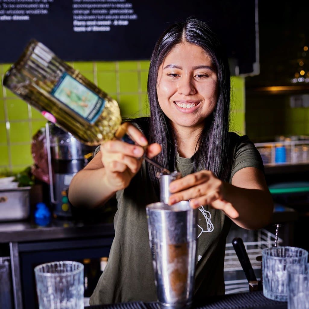 Bar person mixing up a tequila cocktail in Wahaca