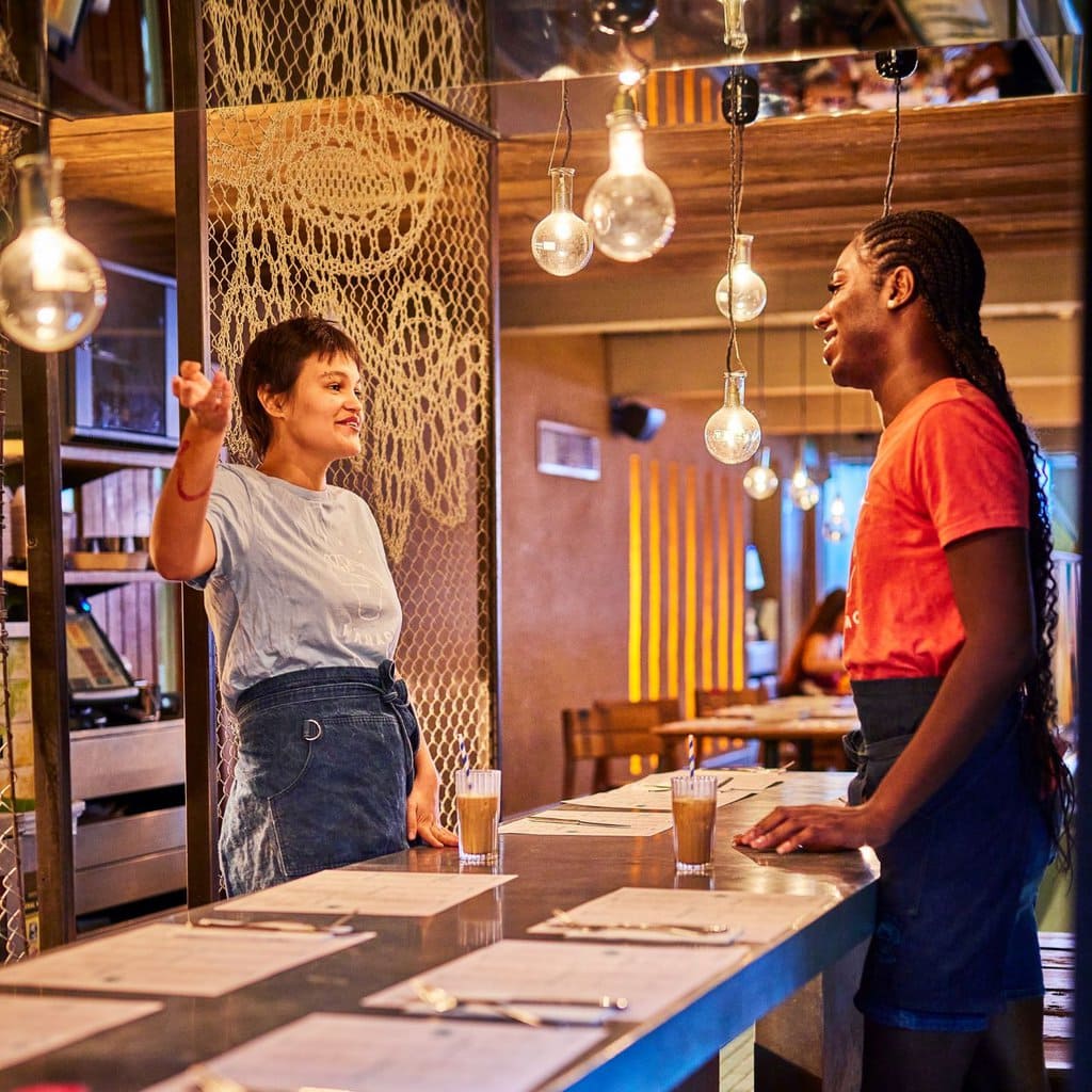 Team talking at Wahaca Waterloo