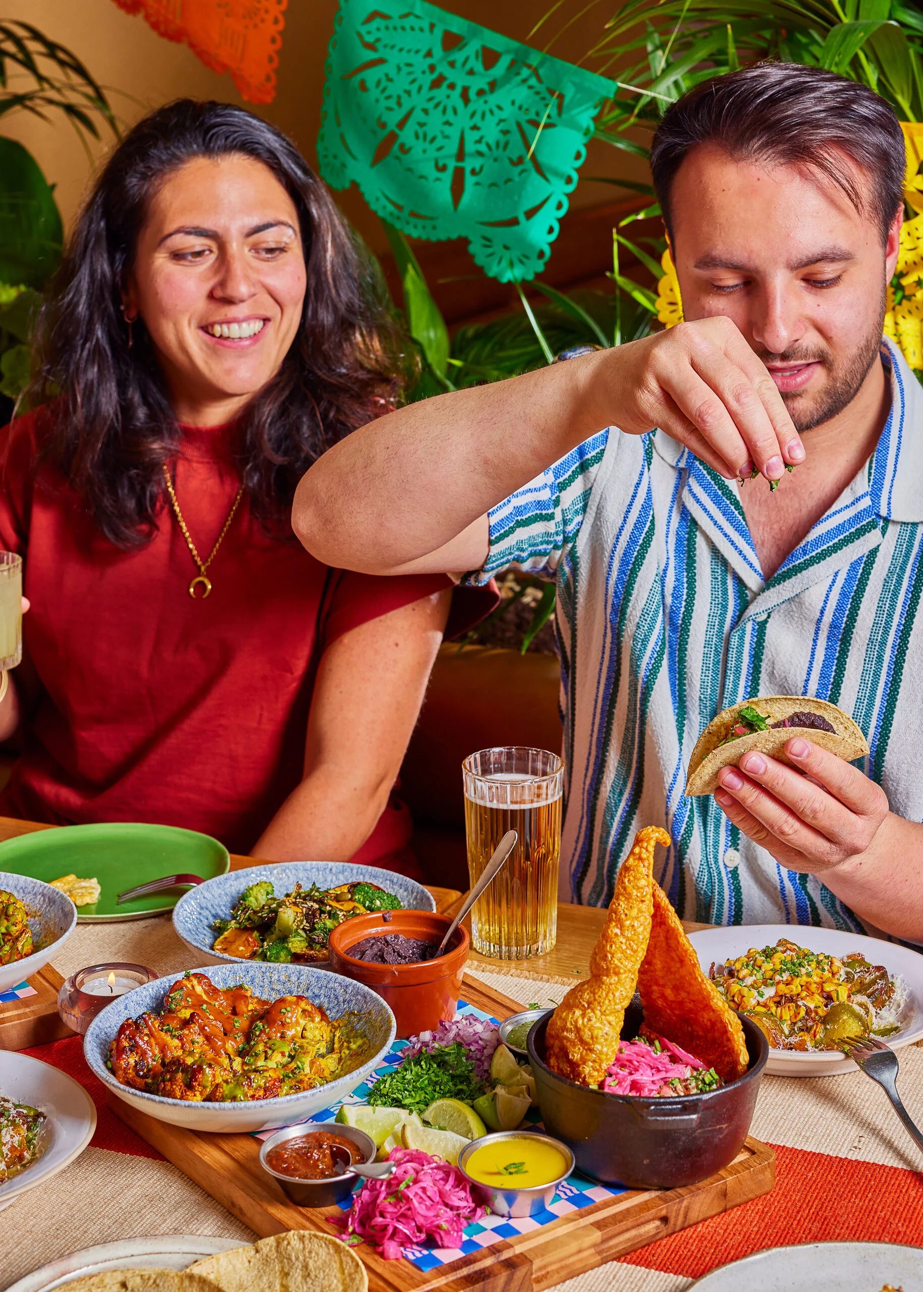 A pair assembling their own tacos from our christmas feasting menu