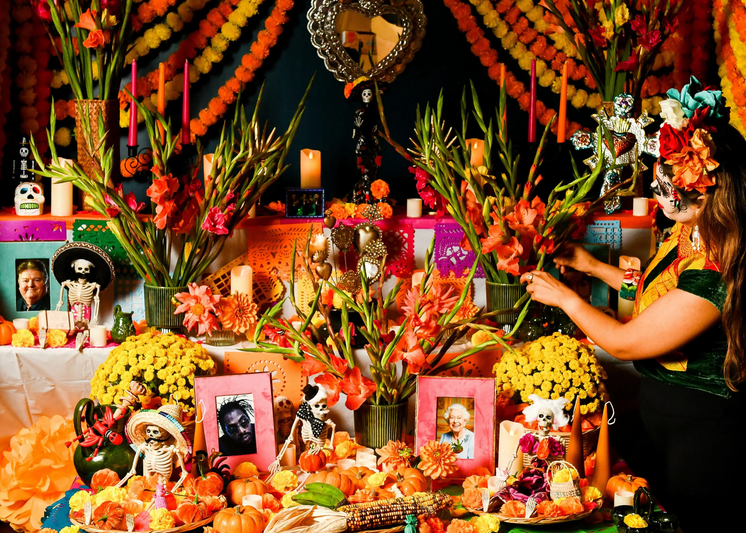 Day of the dead altar in Wahaca restaurant, with flowers, calacas, candles and memories of people who are no longer with us