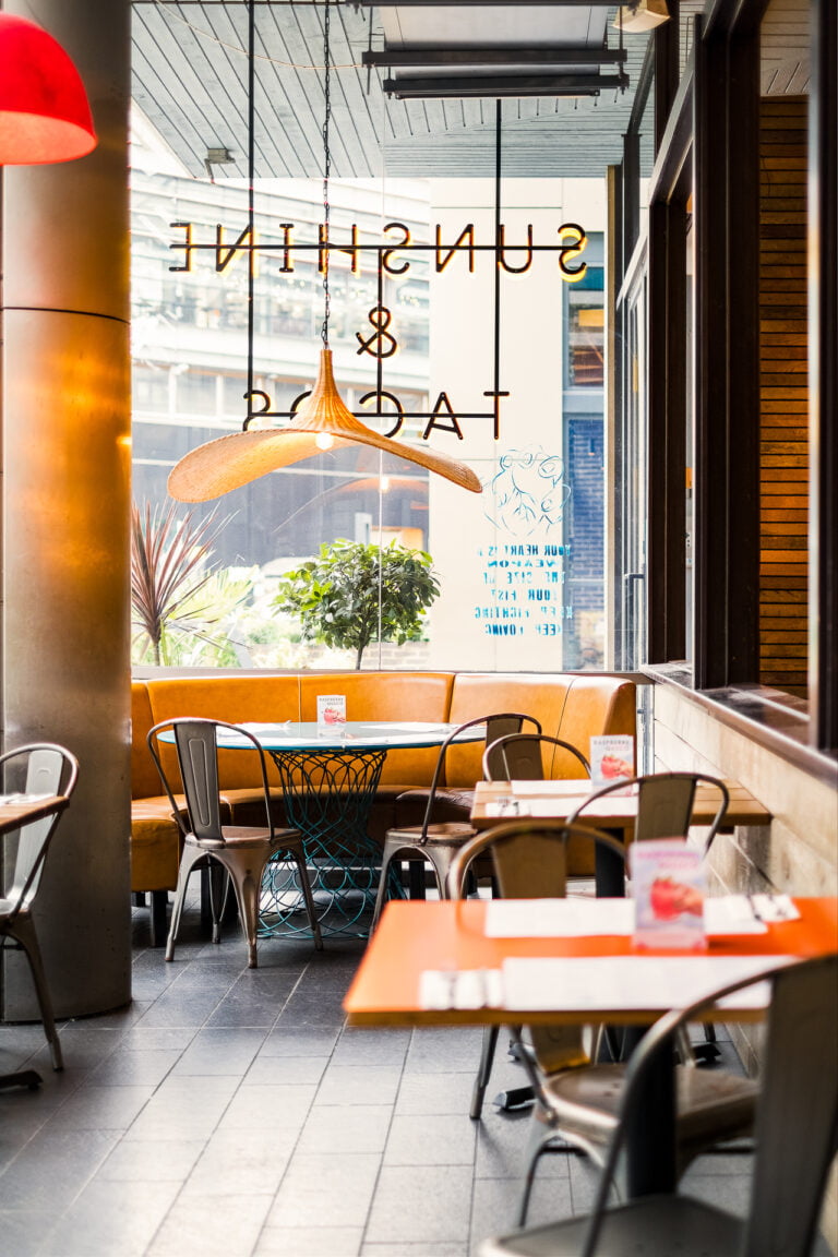 Dining space at Wahaca Stratford with warm colours and natural materials