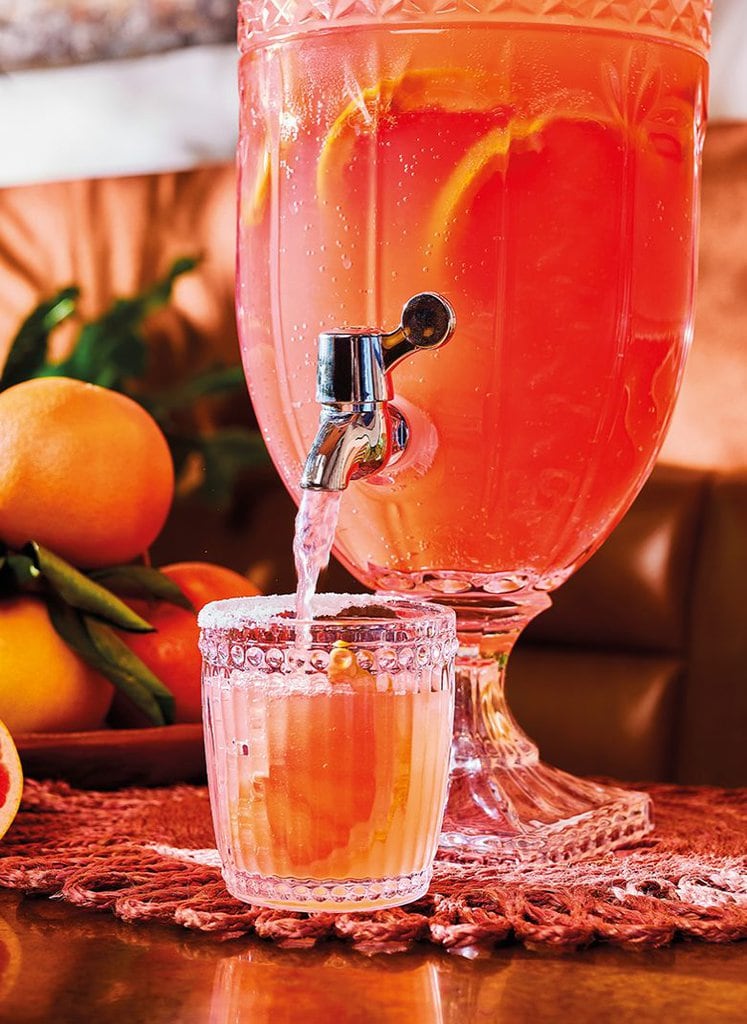 paloma cocktail pouring from a chalice