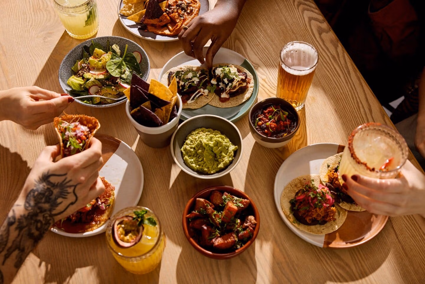 A table full of tacos, margaritas and Mexican small plates at Wahaca