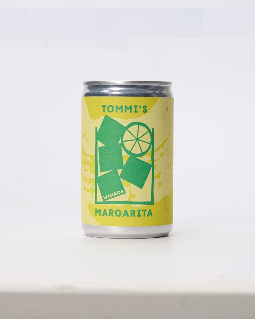 Can of Tommi's Margarita with lime and ice illustration
